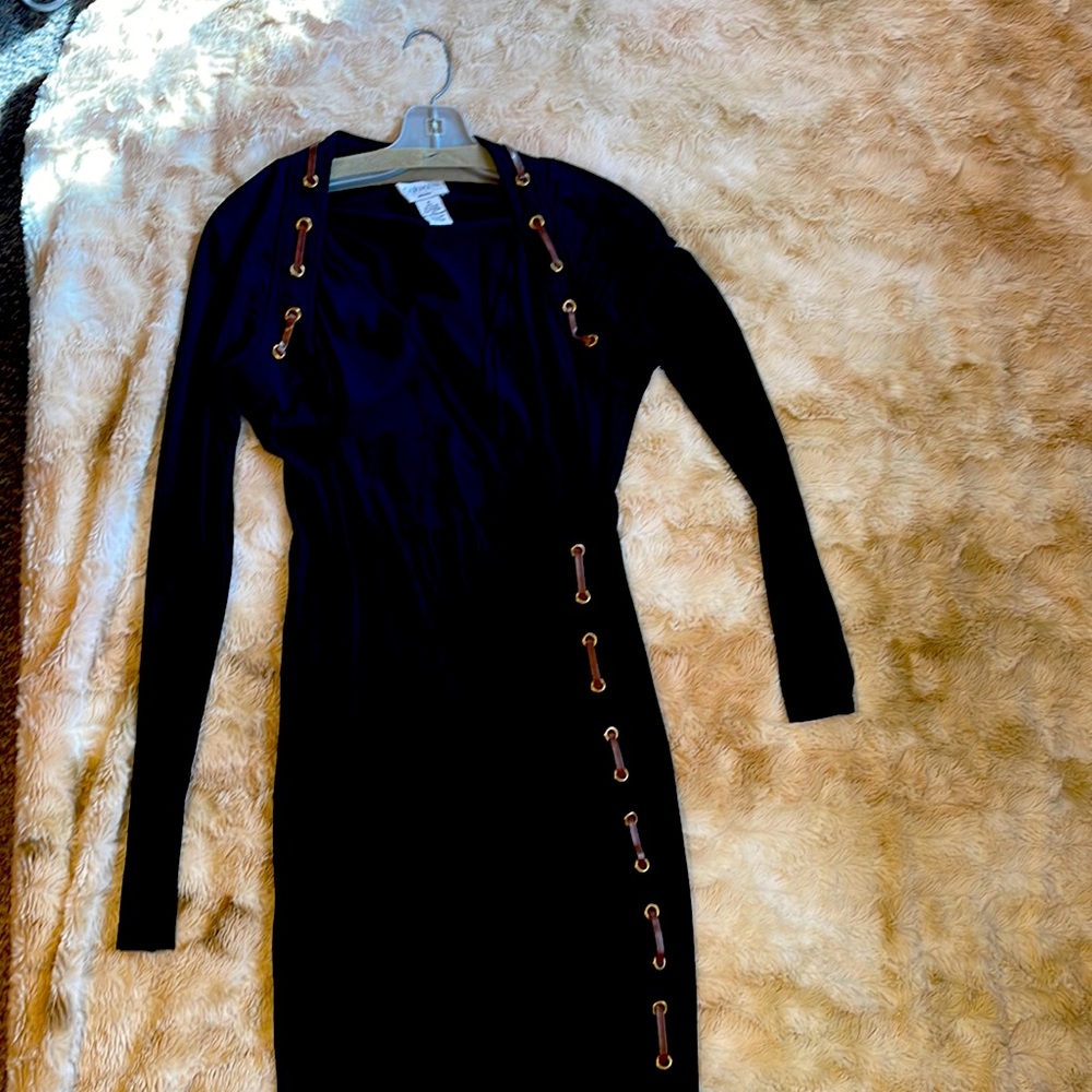 Body conscious black wrap dress.